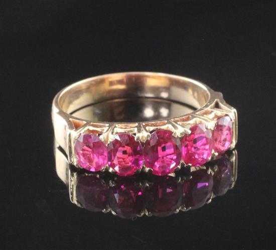 A gold and five stone ruby half hoop ring, size K.